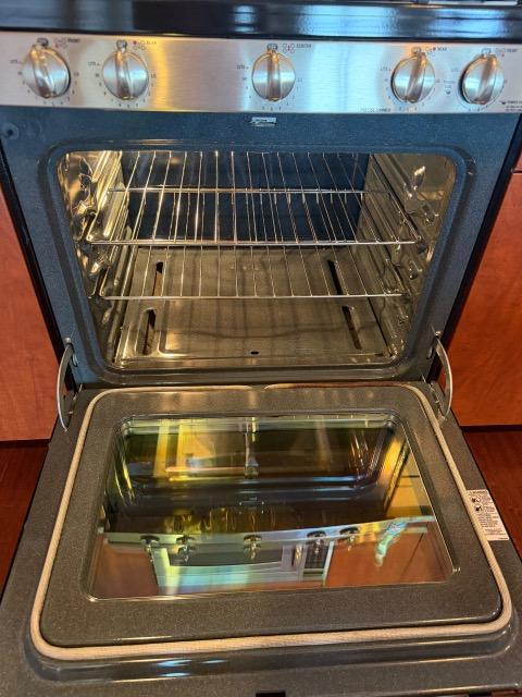 An oven degreased inside, racks cleaned and door glass left clear